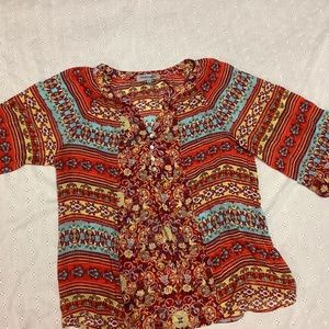 Figueroa & flower brand name. This is a very cute top and it is just like new.